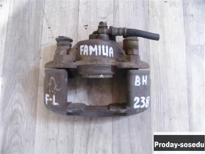 Mazda, Суппорт передний левый, (Familia (BH,Y10) [1994-1999])
